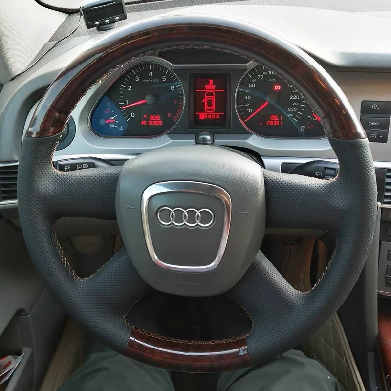 เฉพาะ 05-06-07-08-09-10-11 Audi A6L A4L ฝาครอบพวงมาลัยจริงหนังซุปเปอร์มือเย็บ Grip Cover
