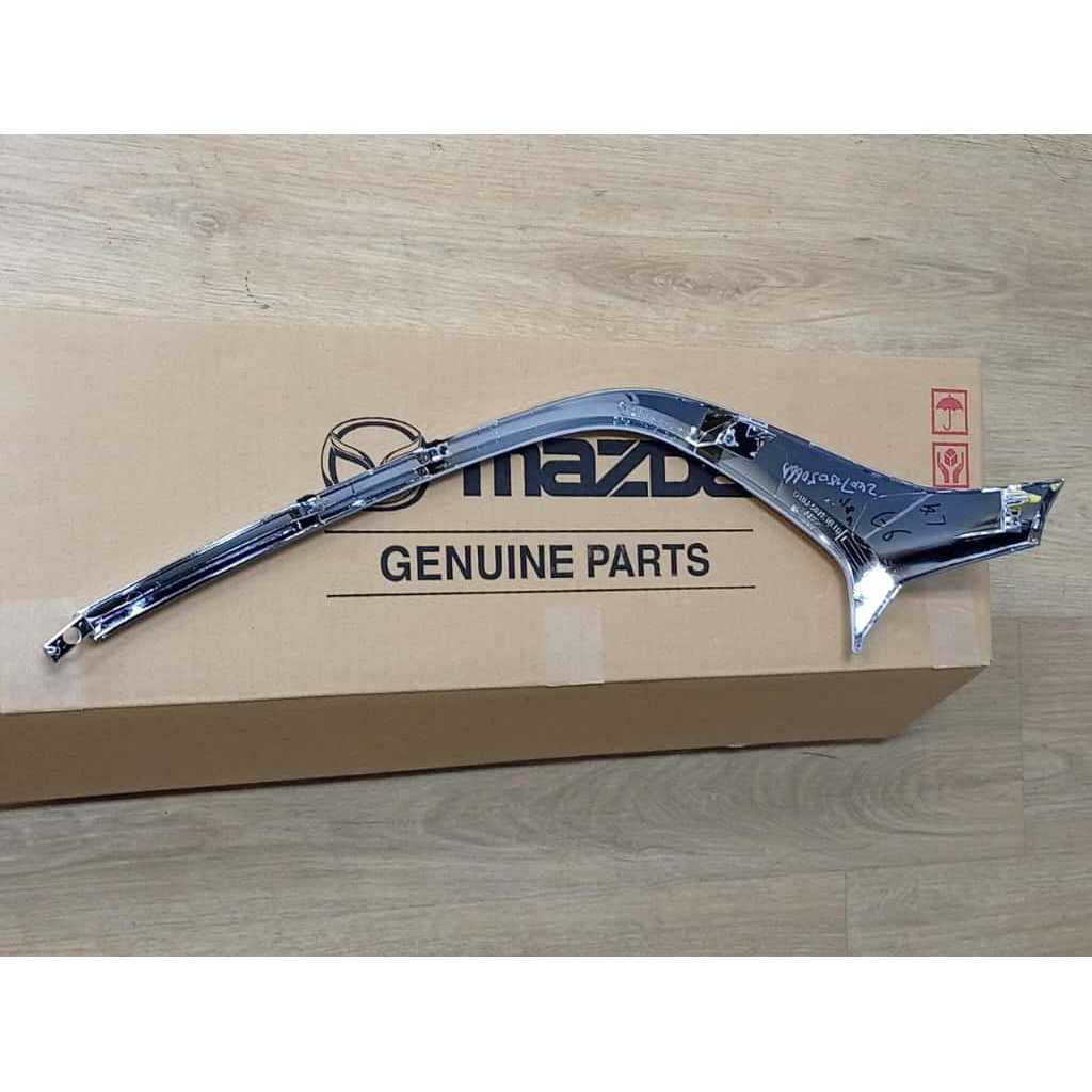 MOULDING RADIATOR GRILLE FRONT / RIGHT > PART > MAZDA LEFT D10J 50 7K0C / RIGHT D10J 50 7J0C
