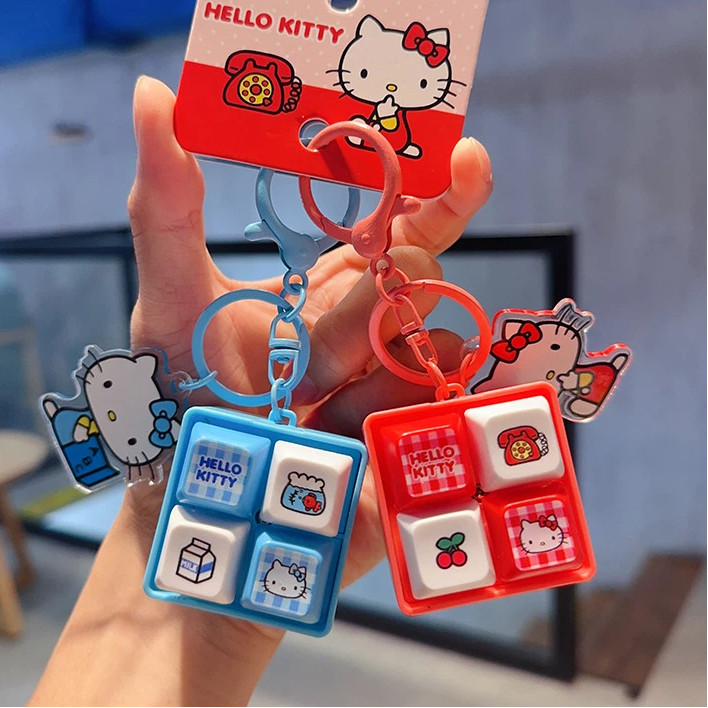 ของแท้ HelloKitty Four-Grid ปุ่มพวงกุญแจ/ของเล่นเสียงสร้างสรรค์จี้ของขวัญขนาดเล็ก