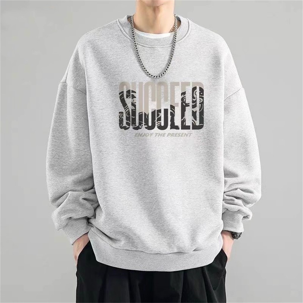 COD✨จัดส่งตลอด 24 ชั่วโมง✨ผู้ชายและผู้หญิง เสื้อสเวตเตอร์คอกลมแขนยาว สไตล์เกาหลี กระแสหลวมๆ COTTON100% กราฟฟิตี้สุดเทรนดี้