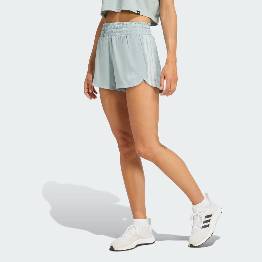 adidas Gym & Training กางเกงขาสั้นเอวสูงผ้าทอ Pacer Workout ผู้หญิง สีเขียว KD7325