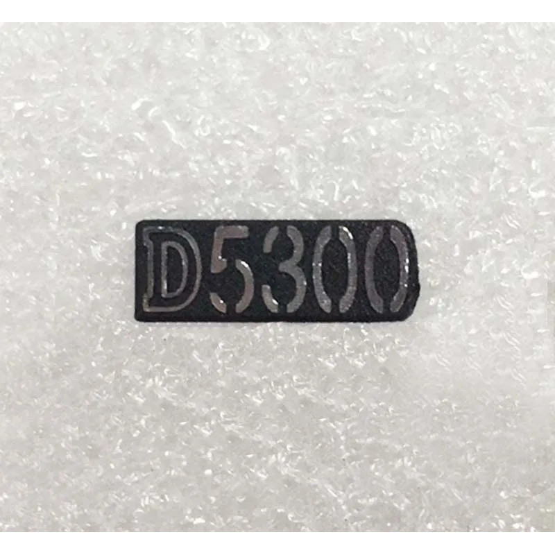 จัดส่งฟรีใหม่เดิมกล้อง SLR โลโก้รุ่นอะไหล่ซ่อมสําหรับ Nikon D5300 D5500 D5600 SLR กล้องดิจิตอล