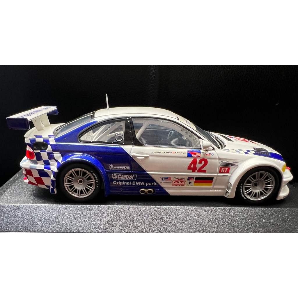 MINICHAMPS 1/43 BMW BMW M3 GTR Racing Model ตัวเครื่องสีขาวลายทางแต่งสีน้ําเงิน ALMS "Petit Le Mans"