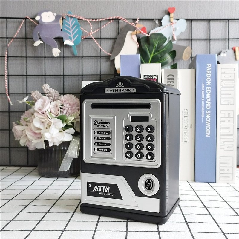 กระปุกออมสิน ข้ามพรมแดนจําลองของขวัญสร้างสรรค์เหนี่ยวนําเพลงรหัสผ่านกล่องอัตโนมัติม้วนเงินลายนิ้วมือ