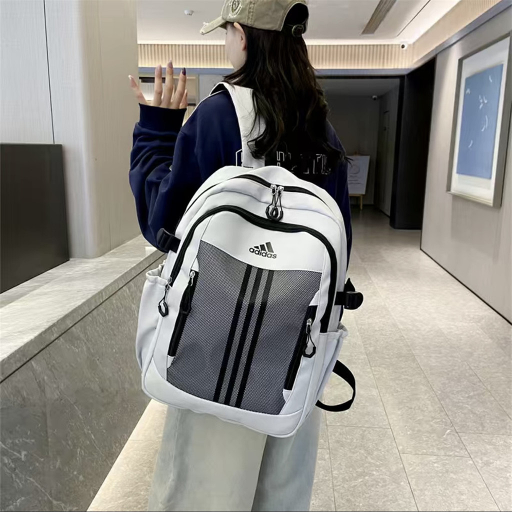 【บริการจัดส่งกรุงเทพฯ】Adidasกระเป๋าเป้สะพายหลังผู้ชายและผู้หญิงใหม่ กระเป๋าเป้สะพายหลังกีฬา กระเป๋าเป้นักเรียน