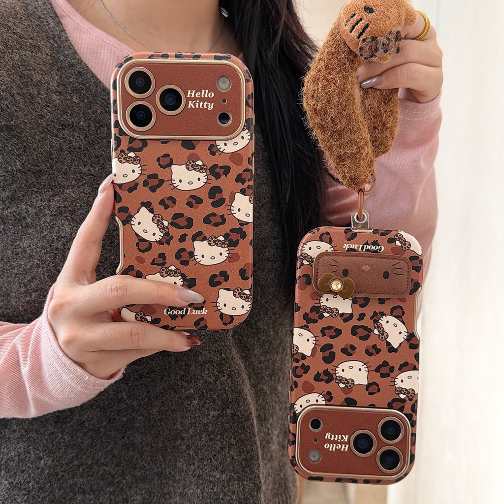 สีน้ําตาลเสือดาวพิมพ์คิตตี้พับยืนเหมาะสําหรับ แอปเปิล 17โปรแม็กซ์ สติกเกอร์หน้าต่างเคสโทรศัพท์ ไอโฟน 16/15/14/13 เชือกเส้นเล็ก