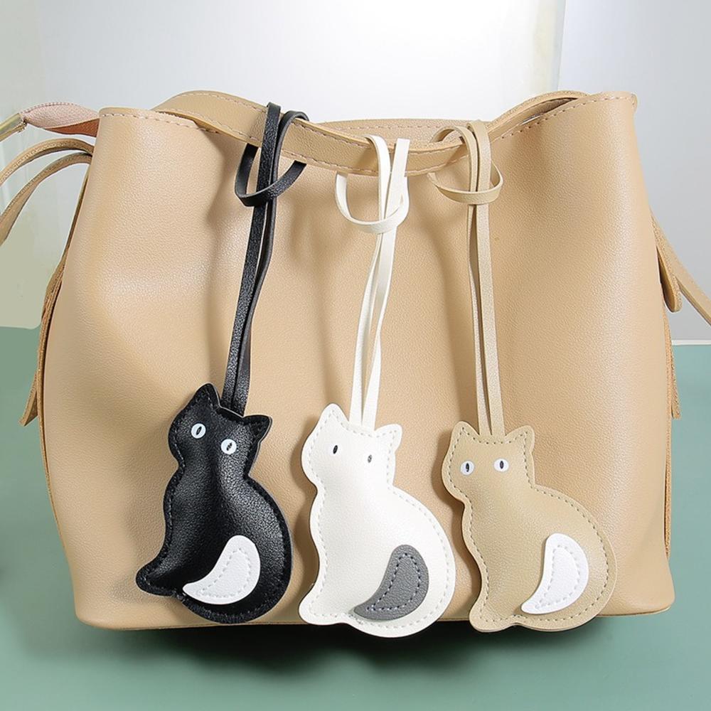 Feline เครื่องประดับรถยนต์น่ารักกระเป๋าแฟชั่น Charm ทนต่อการสึกหรอแบบพกพา Pu จี้หนังสําหรับรถยนต์ครอบครัวใช้การเดินทางทุกวัน - รูปที่ 2