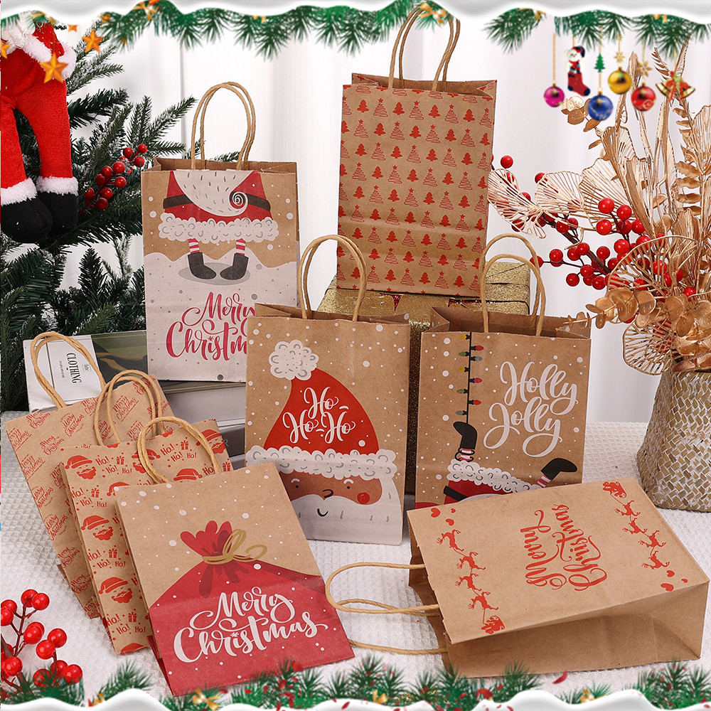 กระเป๋าวันหยุดกระดาษคราฟท์พรีเมี่ยม | รูปแบบซานตาเกล็ดหิมะหมึกถาวร, ที่จับทนทานสําหรับบรรจุภัณฑ์ของขวัญคริสต์มาส