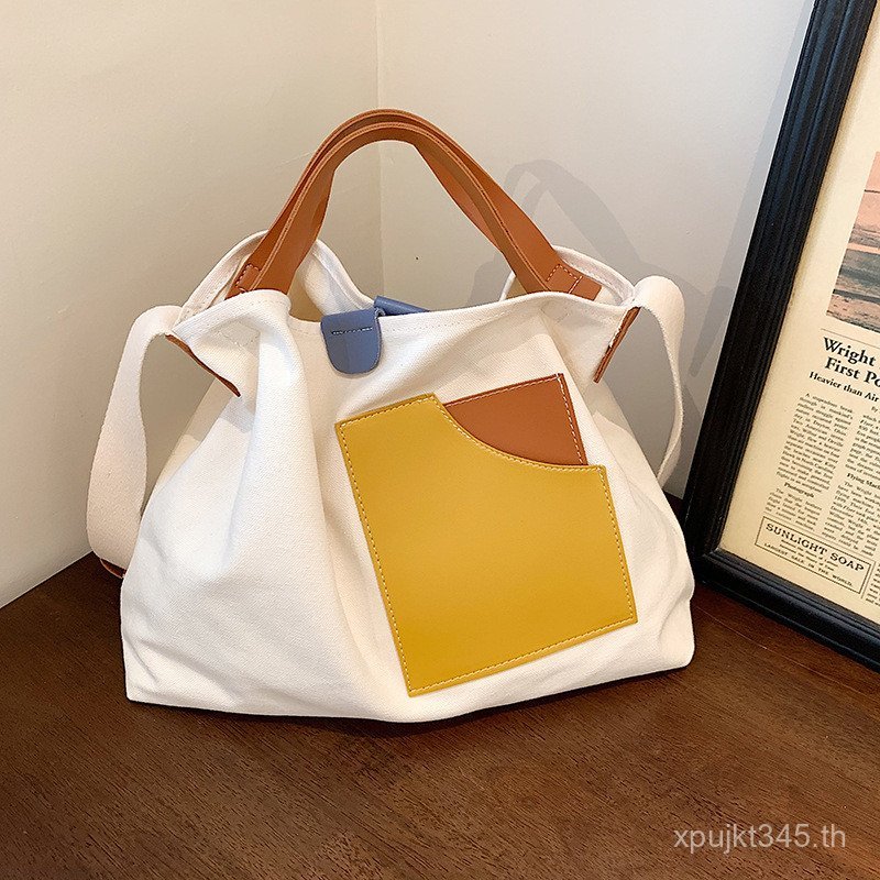 แบบพกพา All-Match กระเป๋าผ้าใบสุภาพสตรีเกาหลี Niche Casual Design กระเป๋าสะพาย Tote กระเป๋า Messenge