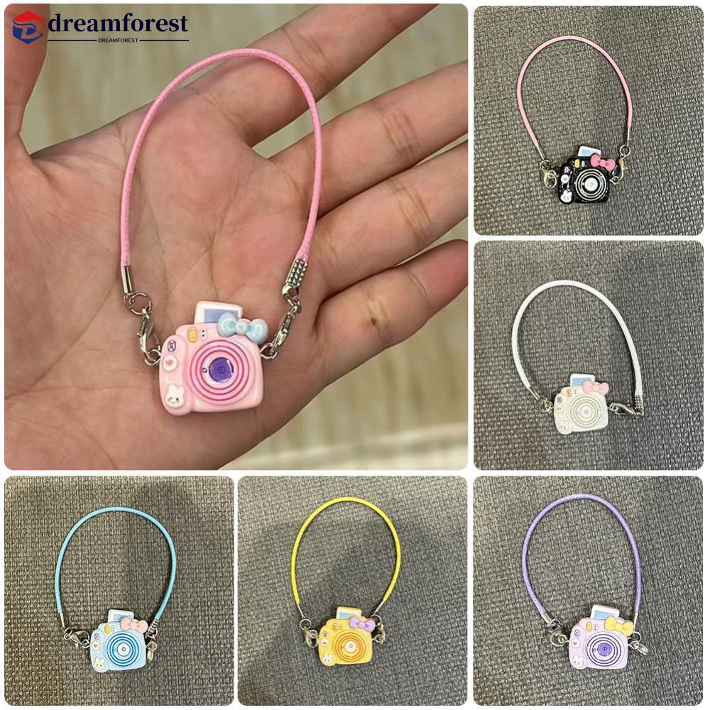 DFS ตุ๊กตามินิจี้รุ่นการ์ตูนกล้องโบว์ห้อยคออุปกรณ์เสริมตุ๊กตาจี้