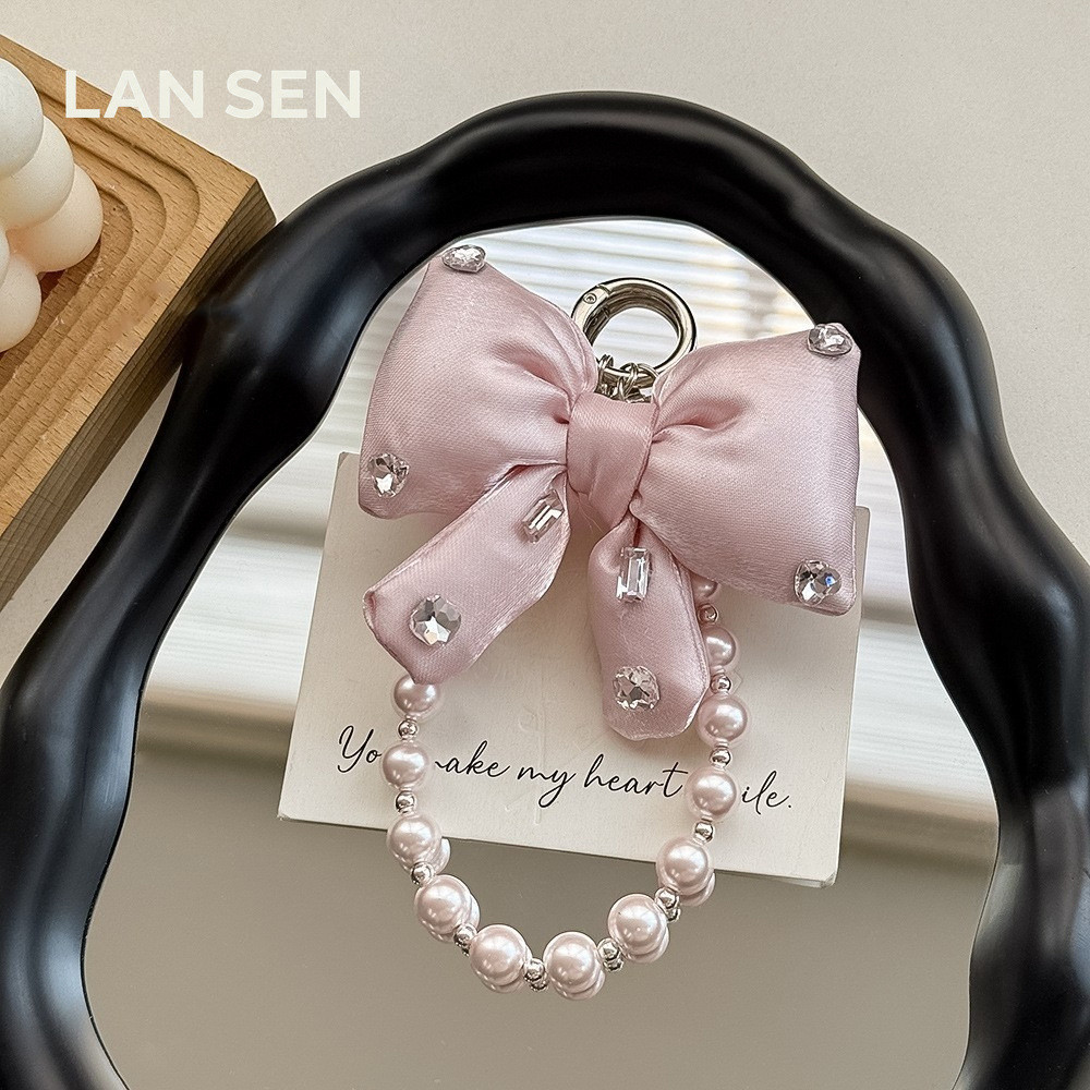 LANSEN [Ready Stock]ยี่สิบ อิน สไตล์มุกสตริงโบว์โซ่โทรศัพท์มือถือรูปแบบใหม่กระเป๋าจี้พวงกุญแจข้อมือเชือกเส้นเล็กสไตล์สั้น ผู้มีอิทธิพล สไตล์ใหม่