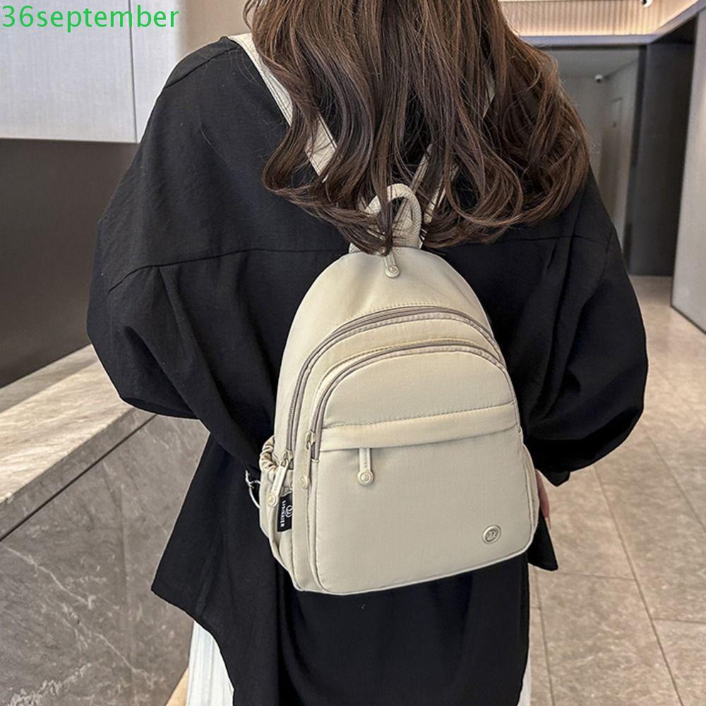 SPEPEMBER Multipockets กระเป๋าเป้สะพายหลังลําลอง,น้ําหนักเบาแบบพกพาผู้หญิงกระเป๋าเป้สะพายหลังไนลอน,สร้างสรรค์พร้อมที่จับกันน้ําสีทึบ Minimalist Commuting กระเป๋าเป้สะพายหลังทุกวัน