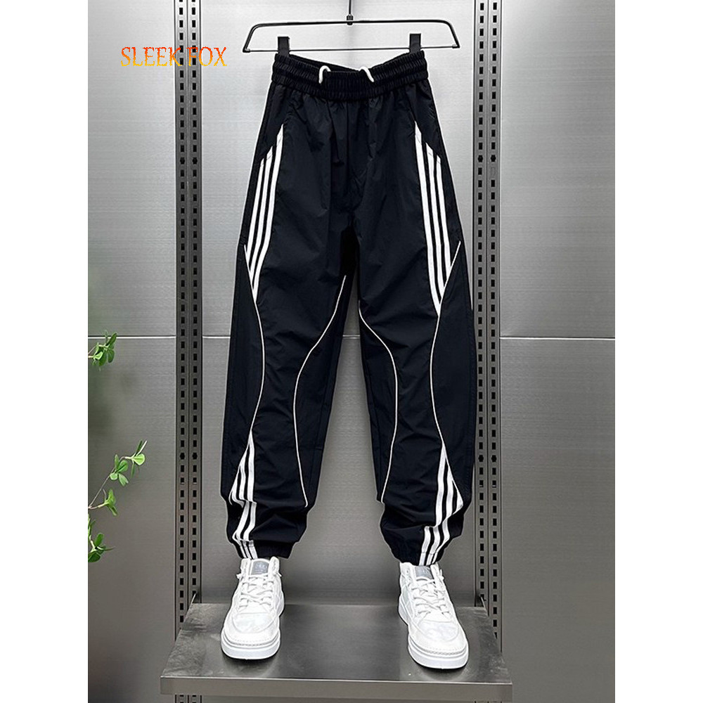 ผู้ชายแฟชั่นทุกการแข่งขันหล่อสไตล์ใหม่ลายเย็บกางเกงกีฬาฤดูร้อนระบายอากาศอินเทรนด์เยาวชนกางเกงลําลอง