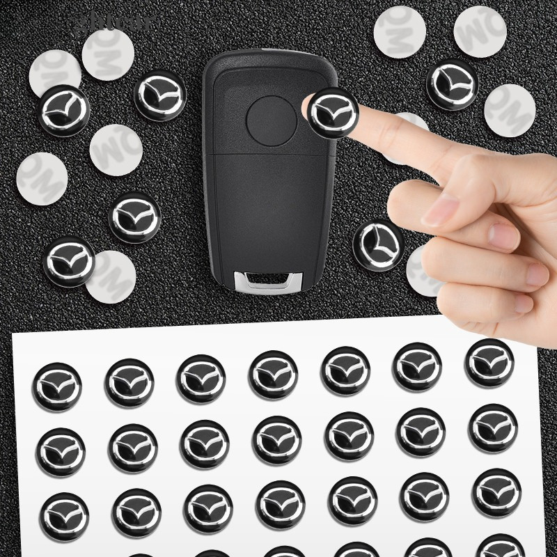 HC 14 มม.อลูมิเนียมรถ Remote Key สติกเกอร์สัญลักษณ์อุปกรณ์เสริมอัตโนมัติสําหรับ Mazda 2 3 5 6 M5 Ms CX-4 CX-5 CX6 M3 M6 MX3 MX5 รถอุปกรณ์เสริม