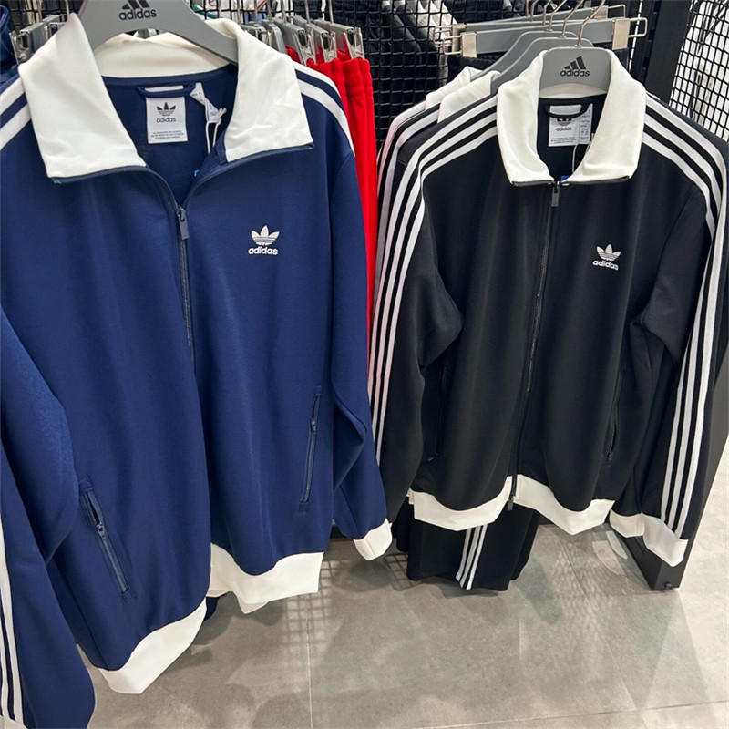 Adidas ปักโลโก้ เสื้อแจ็คเก็ตย้อนยุคลายทาง Unisex เสื้อแจ็คเก็ตคอปกลําลองทําจากผ้าวาฟเฟิล