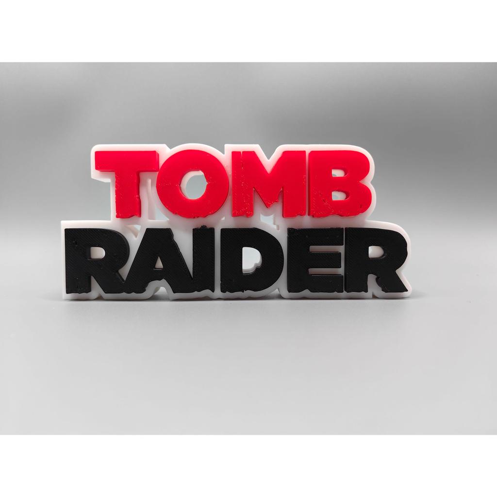 Tomb Raider Tomb Raider โลโก้สามมิติ Fon ยืนแผ่นชื่อแผ่นโลโก้เครื่องประดับ