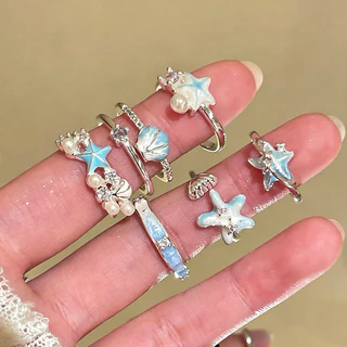 ในไทย✨แหวนรูปปลาดาวและเปลือกหอยสีฟ้า ปรับขนาดได้ สำหรับผู้หญิง เหมาะสำหรับวันหยุดพักผ่อนริมทะเล สามารถใส่ซ้อนกันได้.COD