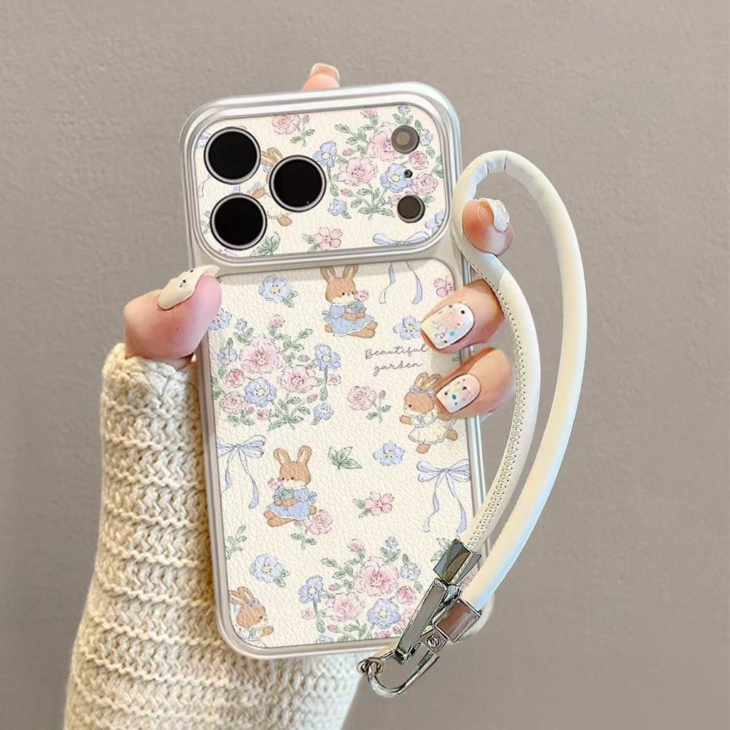 เคสโทรศัพท์ลายกระต่ายและดอกไม้ ใช้ได้กับ iPhone 13/11/12/17/14/15Plus/16ProMax ผลิตจากหนังแท้คุณภาพสูง กันกระแทกและทนทาน