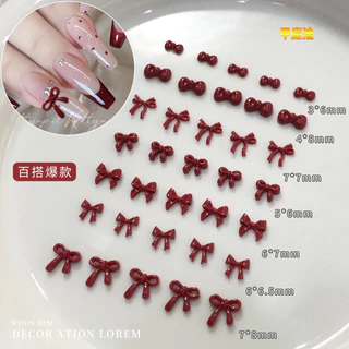 100 ชิ้นอุปกรณ์ตกแต่งเล็บรูปโบว์สีแดง เครื่องประดับโบว์ไท 3 มิติ ทำจากเรซินสีเบอร์กันดี