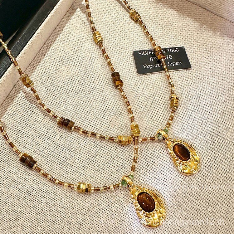 Retro Tiger Eye หินลูกปัดรูปไข่ สร้อยคอคล้องข้อเสื่อมแบบหรูหรา สไตล์เฉพาะและเข้าได้กับทุกลุค 7CFL