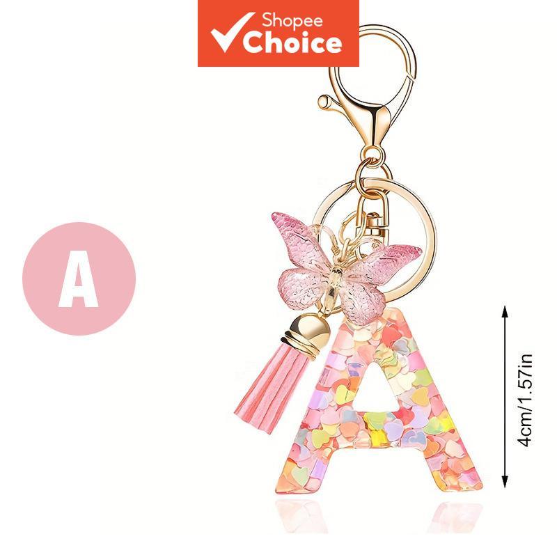 ของขวัญให้แฟนพวงกุญแจตัวอักษรปักเลื่อมสีชมพูประกายพร้อมเสน่ห์ผีเสื้อเริ่มต้นส่วนบุคคล