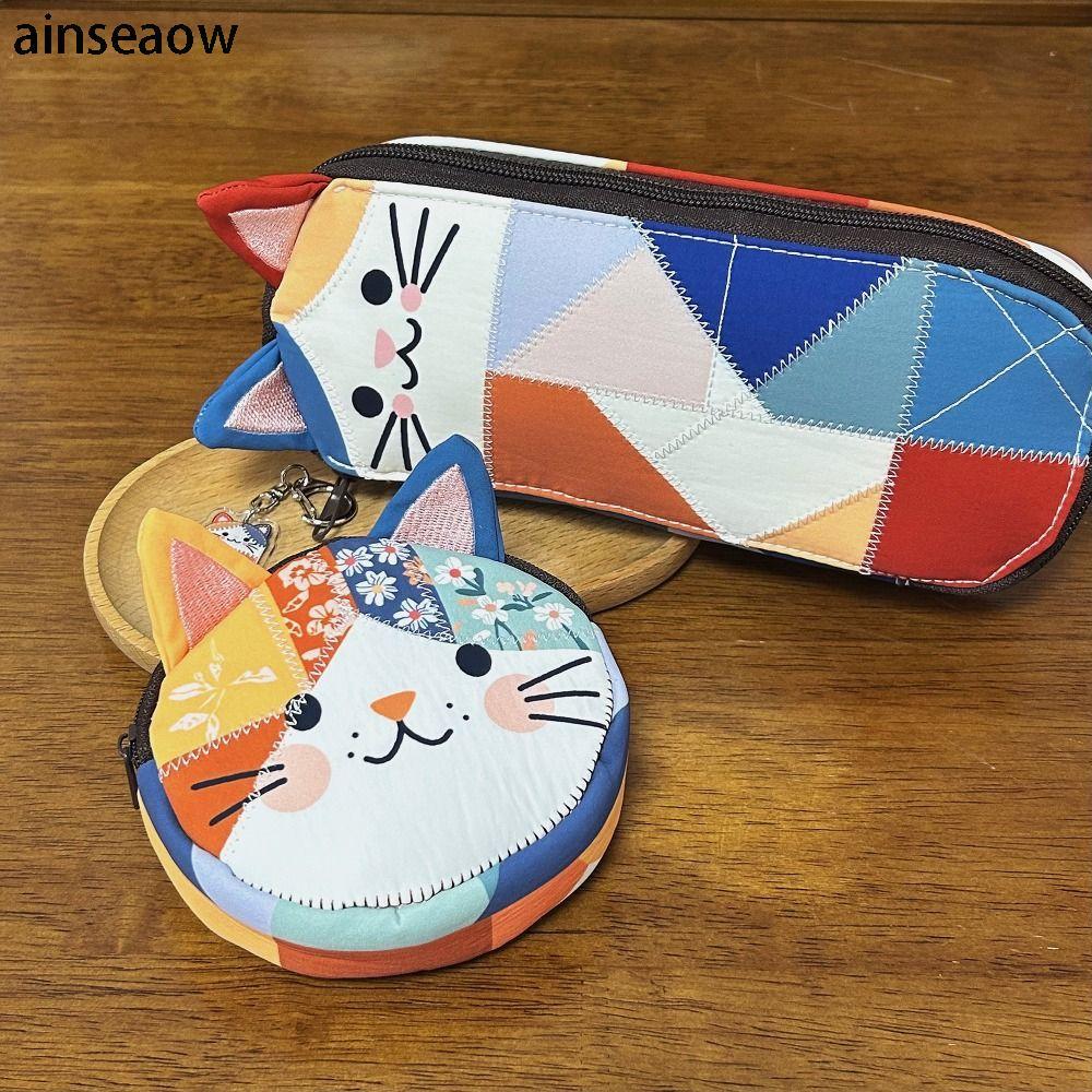 กระเป๋าแต่งหน้าดีไซน์ซิป patchwork และพิมพ์ลายแมว สำหรับใส่อุปกรณ์เครื่องสำอางของคุณอย่างสะดวก