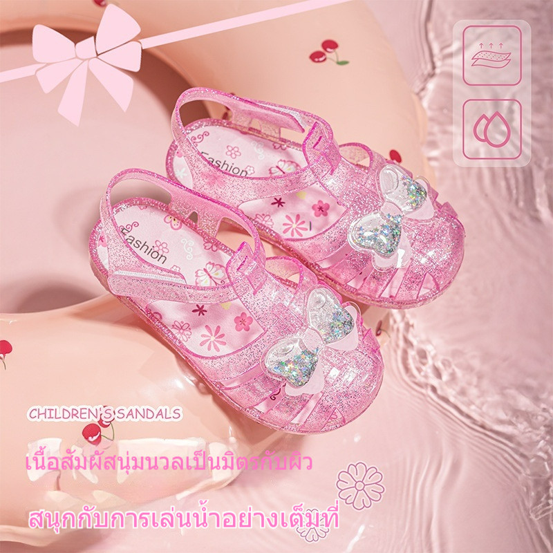 [สต๊อกพร้อมจัดส่งรวดเร็ว] รองเท้าแตะเด็กการ์ตูนสไตล์ใหม่รองเท้าคริสตัลฤดูร้อนสาวนุ่มแต่เพียงผู้เดียวรองเท้าเจลลี่กันลื่นเจ้าหญิงโรมันรองแตะนิ้วSli