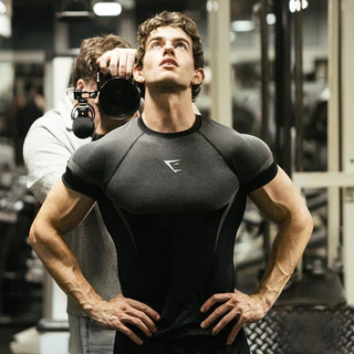 GYM ผู้ชายกล้ามเนื้อสบายๆฟิตเนสเสื้อยืดยืด Breathable สบายกีฬาออกกําลังกาย Shark แขนสั้น Top