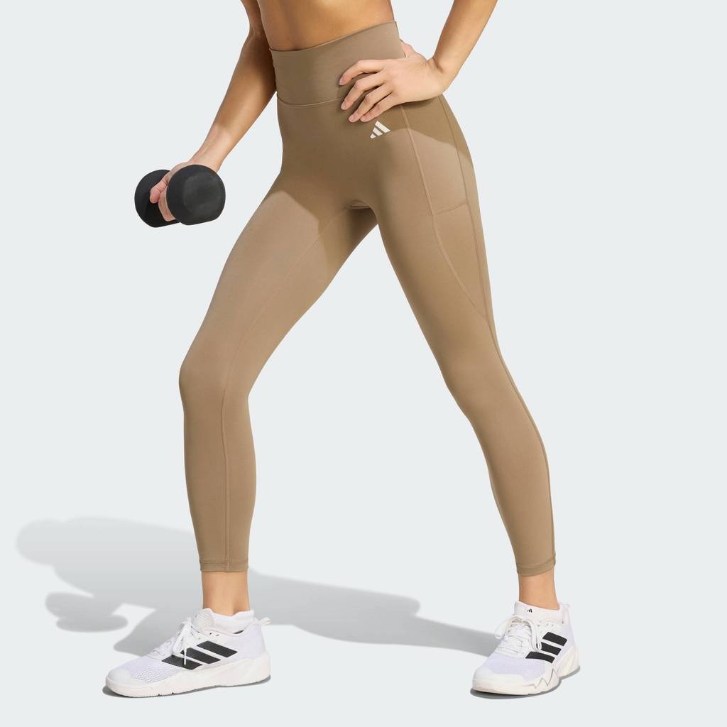 adidas Gym & Training กางเกงรัดรูปเจ็ดส่วนตะเข็บหน้าเรียบ Optime Essentials ผู้หญิง สีเบจ KT3832