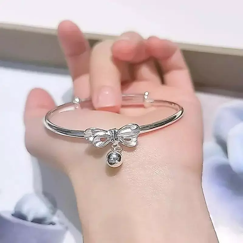 สร้อยข้อมือกระดิ่งปรับได้ ดีไซน์โบว์เงินโลหะ เหมาะสำหรับนักเรียนหญิง ของขวัญวันเกิด