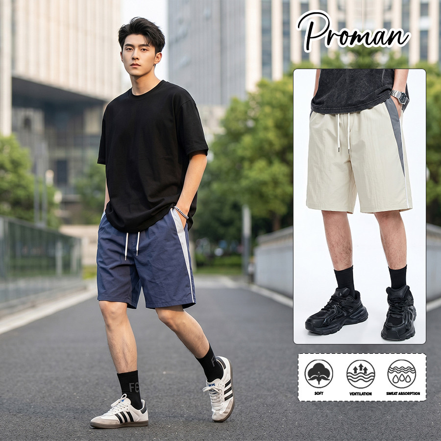 PROMAN กางเกงขาสั้นผู้ชายฤดูร้อน ผ้าเบาแห้งเร็ว ข้างกางเกงตกแต่งแถบสี สไตล์สปอร์ตทรงหลวม ใส่เล่นกีฬาและประจำวัน