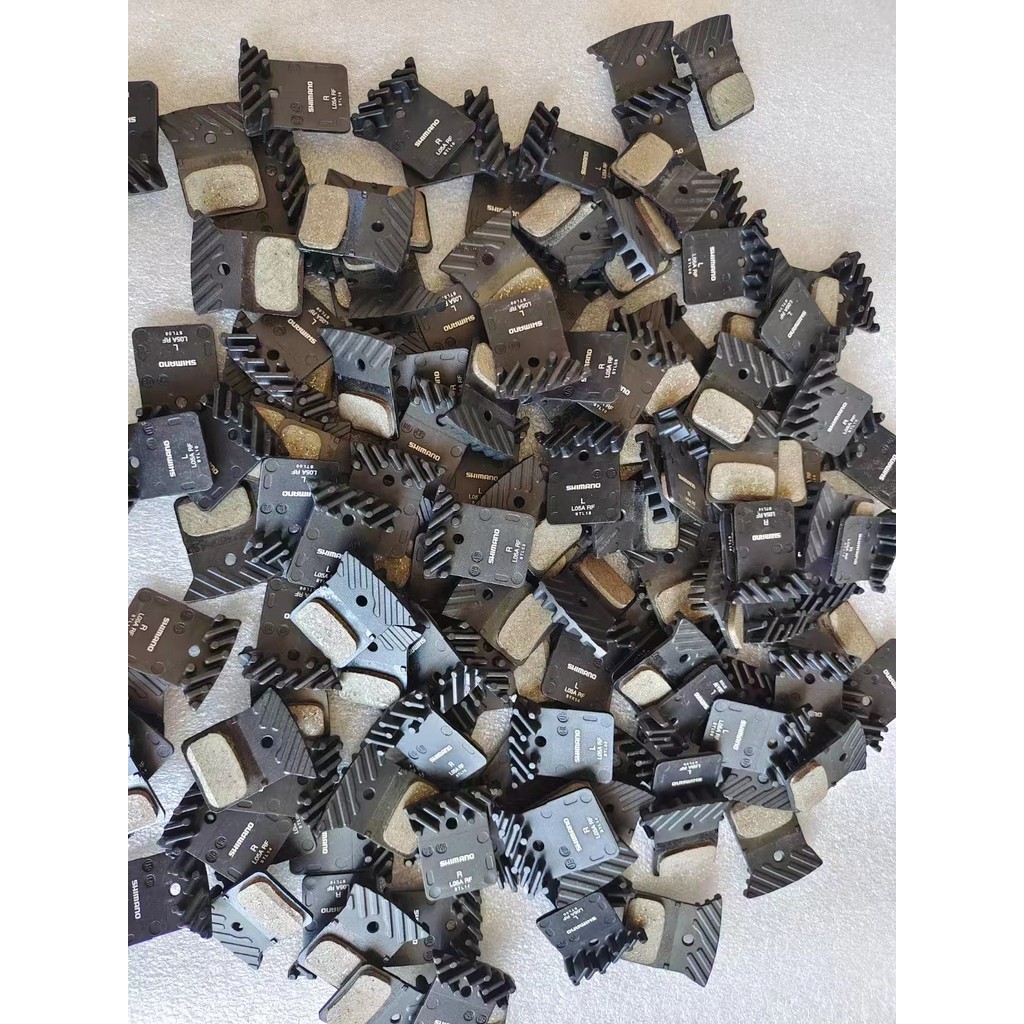 Shimano Shimano L03A L05A L04C จักรยานเสือภูเขาโลหะเรซินผ้าเบรค M8110