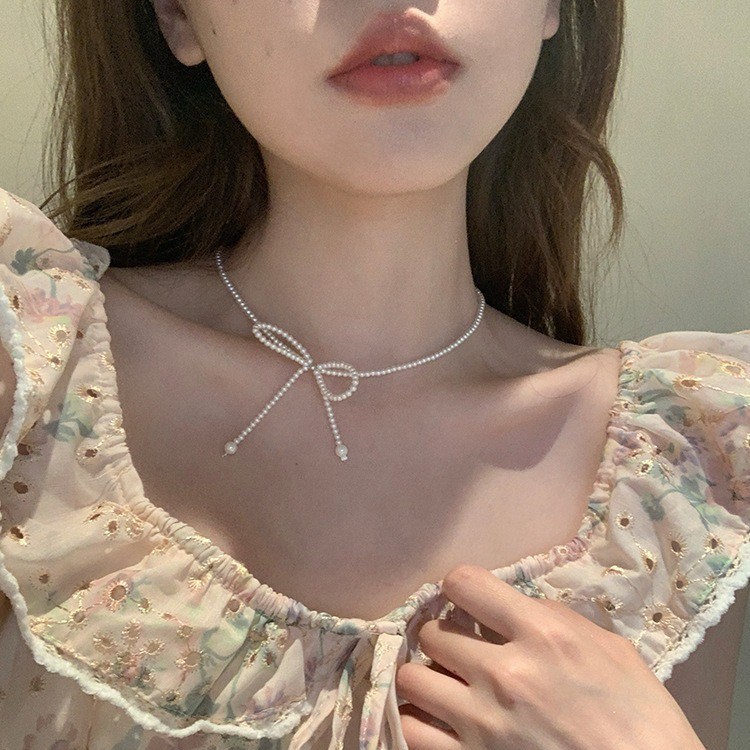 Shijia Pearl Bow Clavicle Chain สร้อยคอลูกป�arl แบบ bow สำหรับหญิง ดีไซน์อ่อนโยน เหมาะสำหรับฤดูใบไม้