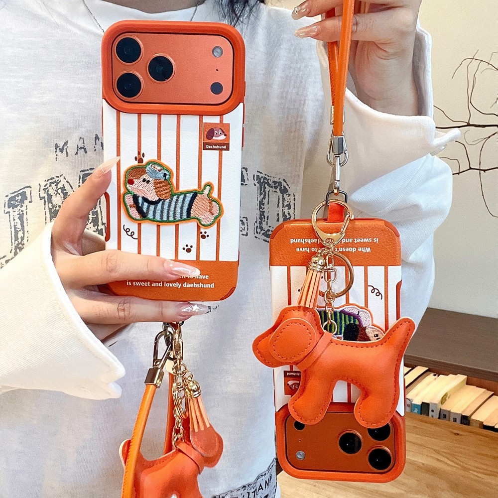 สุนัขไส้กรอกปักลายสีส้มเหมาะสําหรับ ไอโฟน 17โปรแม็กซ์ เคสโทรศัพท์หนัง แอปเปิล 16/15/14/13 เชือกเส้นเล็ก