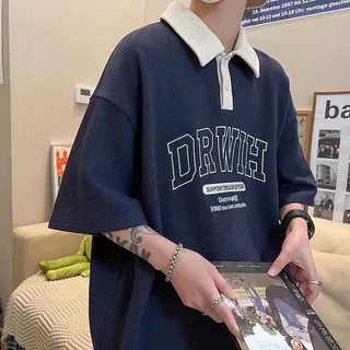 PROMAN เสื้อโปโลผ้าตารางวาฟเฟิล ทั้งชายหญิงใส่ได้ ลายพิมพ์ สไตล์เกาหลี ทรงโอเวอร์ไซส์ แต่งได้หลายลุค คอปก