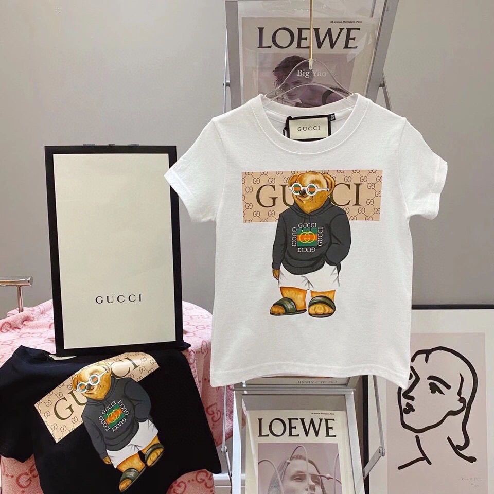 G GUCCI3258 เสื้อยืดเด็กการ์ตูนพิมพ์รอบคอผ้าฝ้ายแขนสั้นชายหญิงเด็ก Street Wear GG เสื้อผ้า