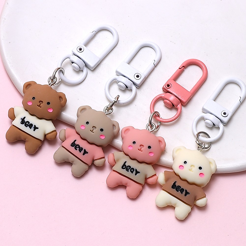 1 ชิ้นคนรักการ์ตูนครีมหมีพวงกุญแจ Charm สําหรับพวงกุญแจกระเป๋าเป้สะพายหลังแขวนสําหรับของขวัญนักเรียน