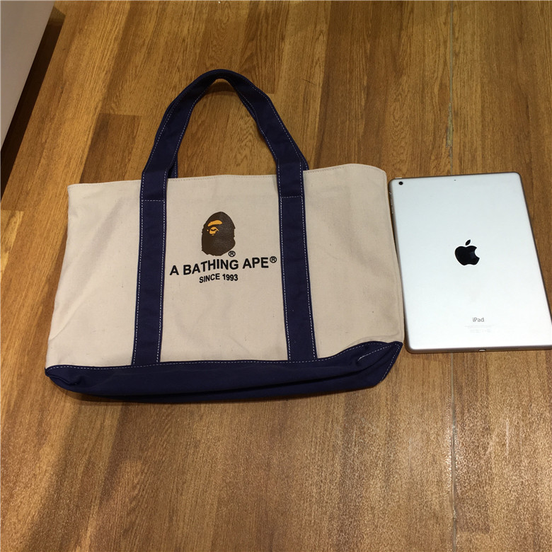 Magazine Appendix bape ABATHING APE กระเป๋าสะพายแบบพกพากระเป๋าช้อปปิ้งกระเป๋าผ้าใบเปิด