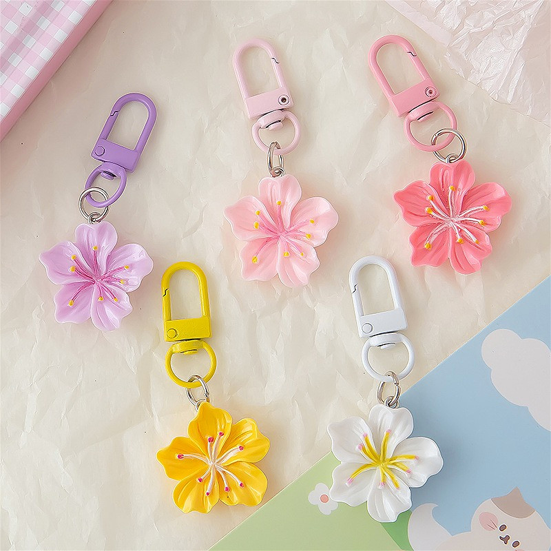 แฟชั่นเรซิ่นที่มีสีสันซากุระพวงกุญแจจี้กุญแจรถเครื่องประดับที่เรียบง่ายกระเป๋าเป้สะพายหลังโทรศัพท์แขวนอุปกรณ์