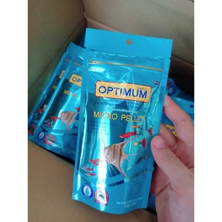Optimum Micro pellet อาหารปลาเล็ก ปลาหางนกยูง อาหารปลานีออน เม็ดไมโคร น้ำไม่ขุ่น 50 g.