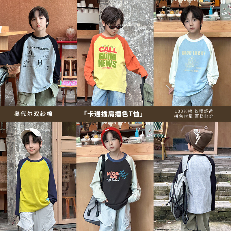 เสื้อยืดรุ่นใหม่สำหรับเด็ก การ์ตูนตัวอักษรแบบ Raglan สไตล์ฤดูใบไม้ร่วง ปี 2025 พร้อมลายเส้นด้ายคู่จากผ้าฝ้าย