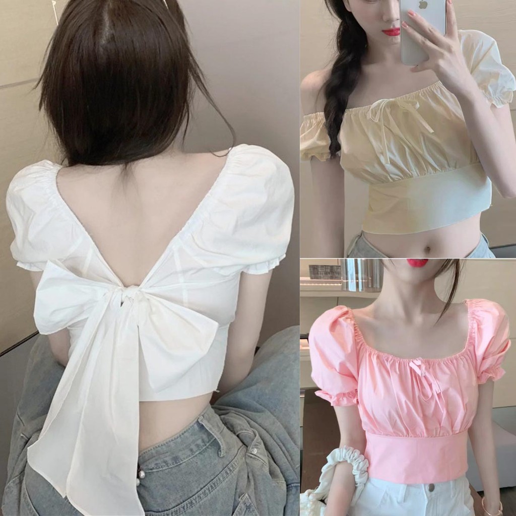 เสื้อแฟชั่นทรงปาดไหล่ แขนตุ๊กตา รุ่นสม็อคอก เนื้อผ้าคอตตอน แต่งผูกโบว์หน้าหลัง สไตล์เกาหลี น่ารัก สำหรับสาวหวาน
