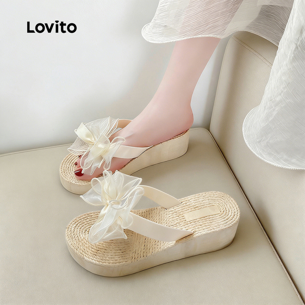Lovito โบโฮ รองเท้าแตะแบบแบนสไตล์รีสอร์ท พื้นสีขาวครีม พร้อมโบว์ตกแต่งสําหรับผู้หญิง LFA112014