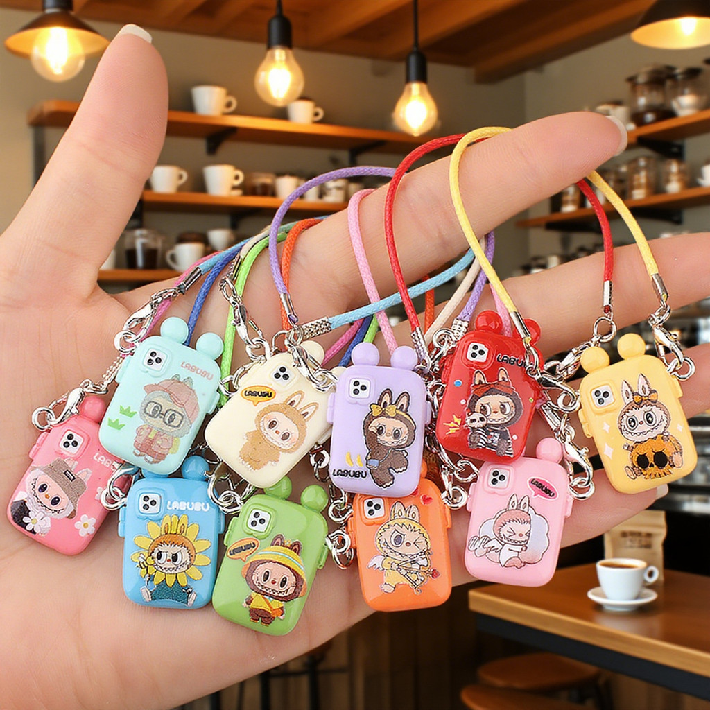 ตุ๊กตามินิการ์ตูนขนาดเล็กเคสโทรศัพท์จี้รุ่นสร้างสรรค์อุปกรณ์เชือกแขวนคอเครื่องประดับตุ๊กตา