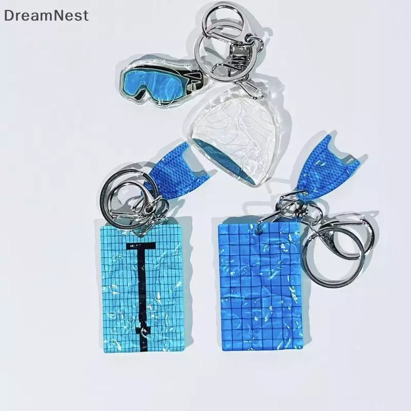 [DreamNest] 1 ชิ้นหมวกว่ายน้ําแหวนกุญแจรถสร้างสรรค์สระว่ายน้ําหยักพวงกุญแจตกแต่งกระเป๋าจี้ Swimmers ของขวัญ (th)