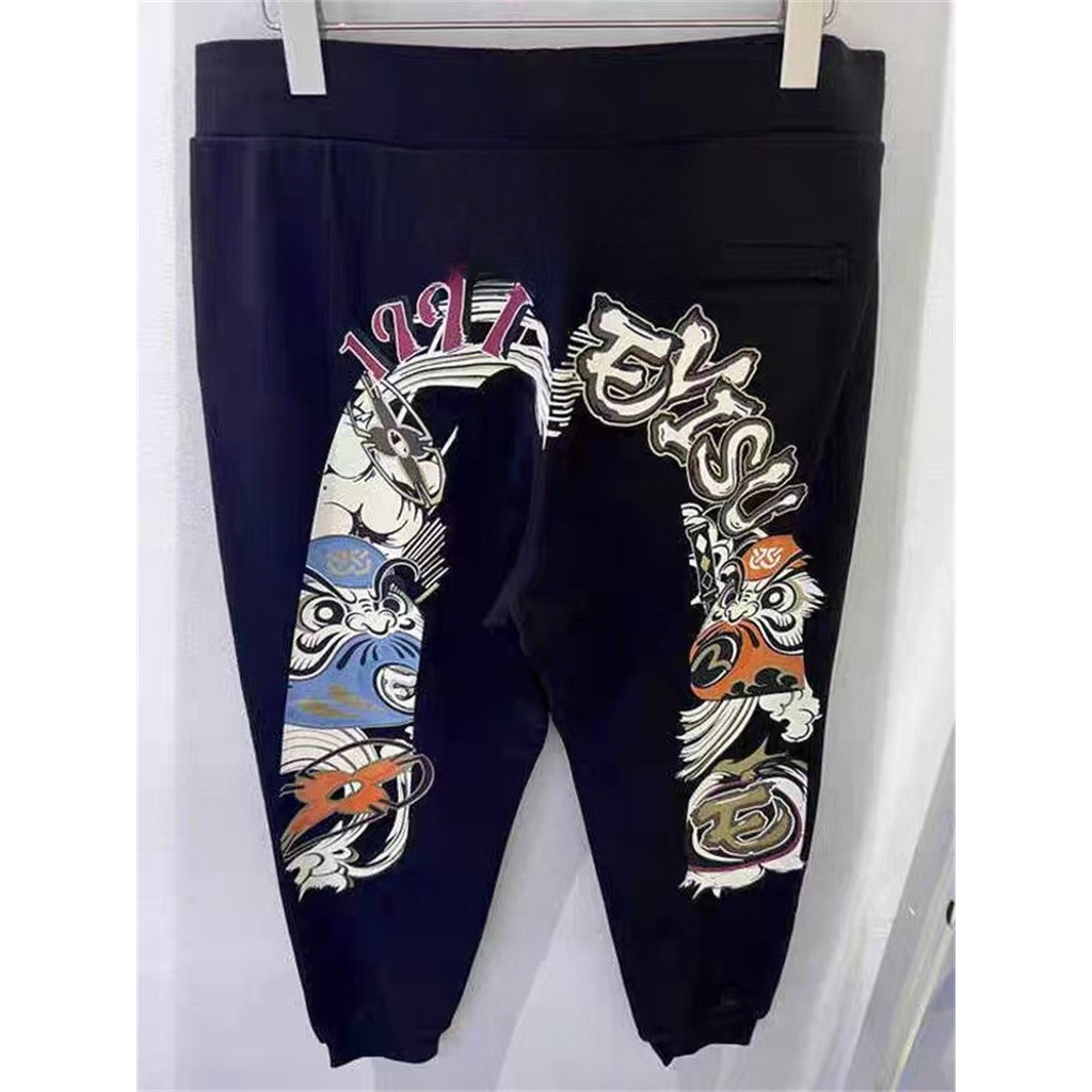เสื้อผ้าขนาดใหญ่แฟชั่น Sweatpants ผ้าฝ้าย มีกราฟิตี้ลายตัวอักษร สายเอวยางยืด เหมาะสำหรับทั้งผู้ชายและผู้หญิง