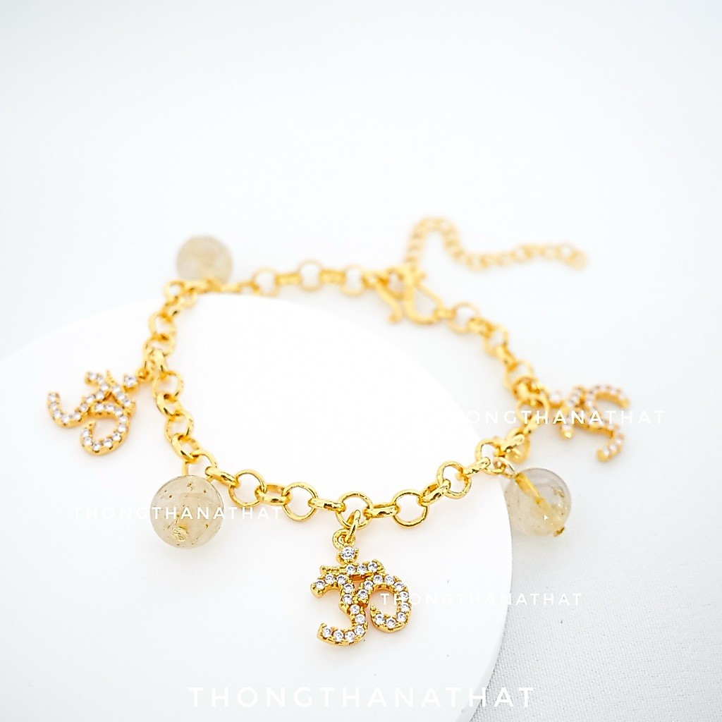 สร้อยข้อมือโอมไหมทอง สายปรับไซส์ เทพเจ้าแห่งความสำเร็จ คิดสมปรารถนา โอม พระพิฆเนศ สร้อยข้อมือโอม ไหมทอง ข้อมือไหมทอง