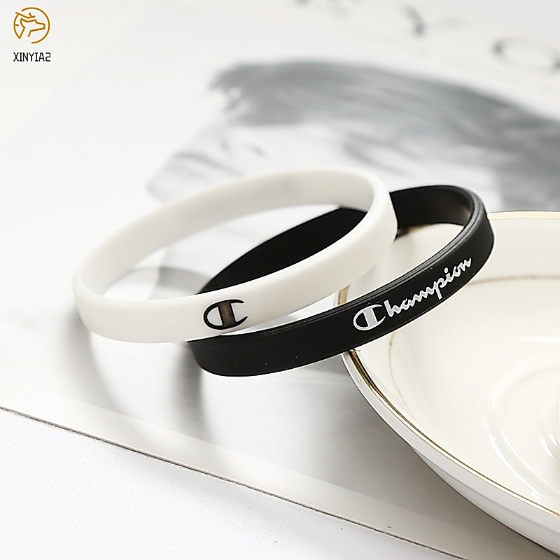 Champion สร้อยข้อมือยาง สร้อยข้อมือคู่ กำไลข้อมือซิลิโคน สไตล์กีฬา สีดำและสีขาว ลายตัวอักษร สำหรับผู้ชายและผู้หญิง