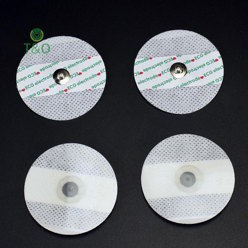 T&O 50 ชิ้นทิ้ง ECG Electrodes Medical Electrode Patch EKG อุปกรณ์เสริมไม่ทอ ECG Electrode แผ่นผ้าไม