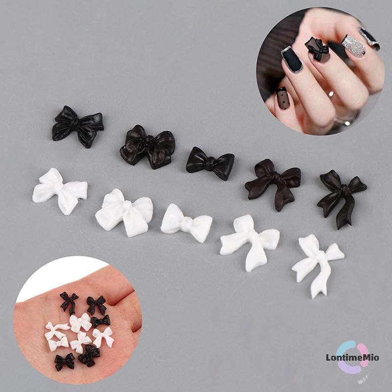 LontimeMio] 50 ชิ้นโบว์เรซิ่นตกแต่งเล็บสีดําสีขาว 3D ยาวริบบิ้น Bowknot เครื่องประดับเล็บ Charm เครื่องประดับออกแบบ DIY อุปกรณ์เสริมใหม่